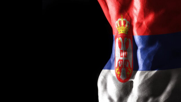 Foto bandiera della serbia sull'allenamento sportivo nazionale dei muscoli addominali, concetto di bodybuilding, sfondo nero