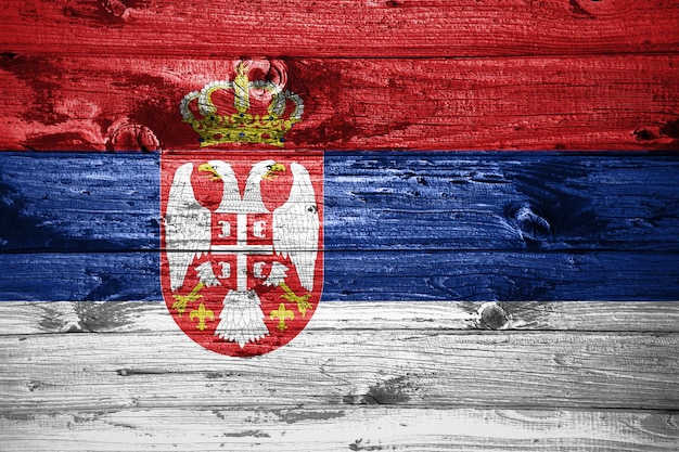 Photo serbia flag on wooden planks background wood flag