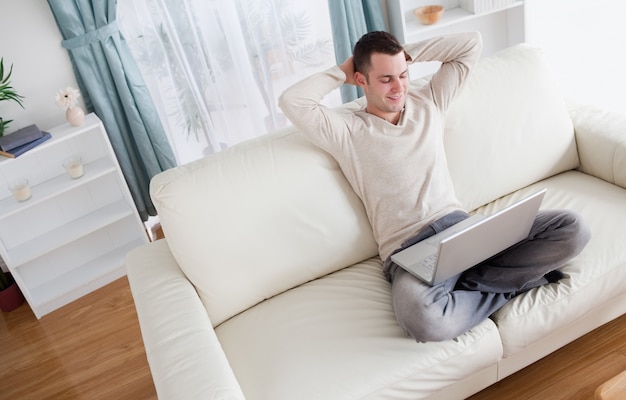 Serene man using a notebook