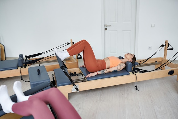 serene pilates woman on rowing machine