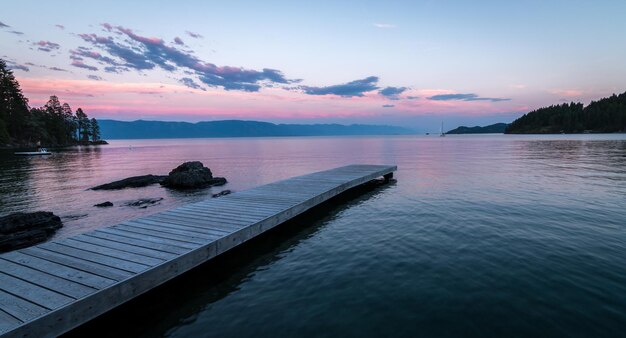 A serene sunset on flathead lake in montana invites reflection and rest