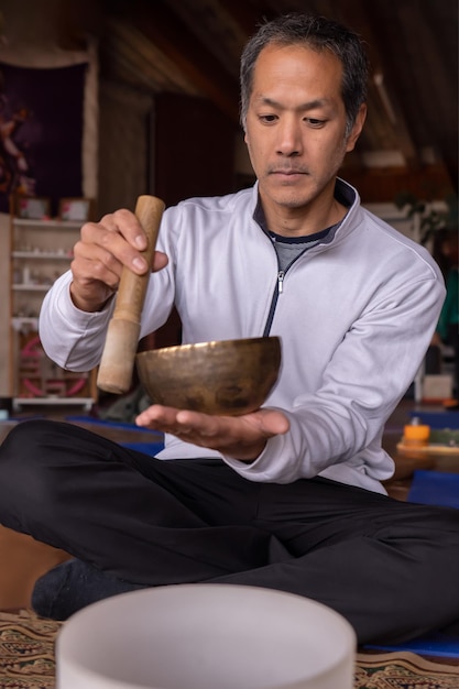 A serene young Asian meditator immersed in Tibetan Buddhist tradition