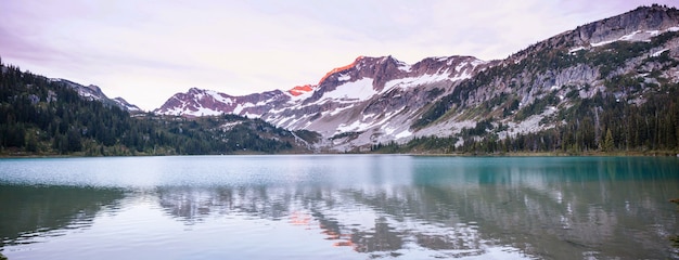 Serenity lake in the mountains in summer season. Beautiful natural landscapes.