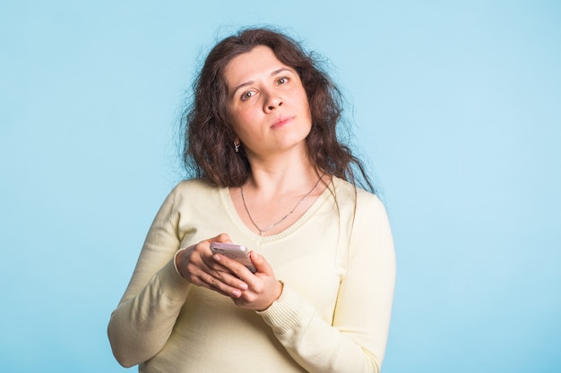 Serious adult woman in a casual blouse