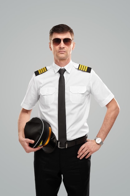 Serious airline pilot in studio