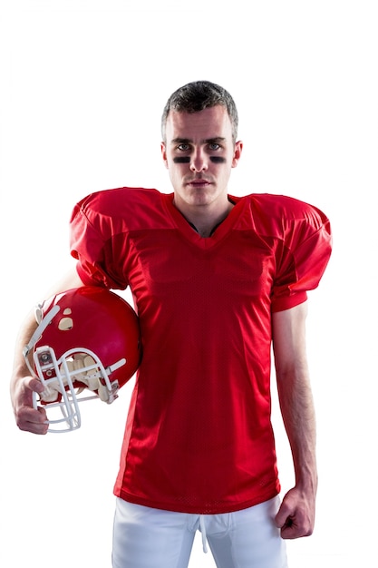 A serious american football player looking at camera