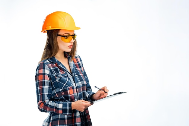 Serious attractive architect woman with hard hat Isolated on white background Smart clever lovely stylish nice cute brunette girl in casual clothes Wearing protective glasses holding folder