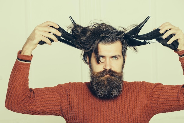 Serious bearded man with shoes