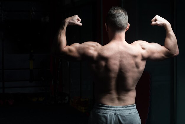 Serious bodybuilder standing in the gym