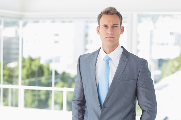 Serious businessman looking at camera