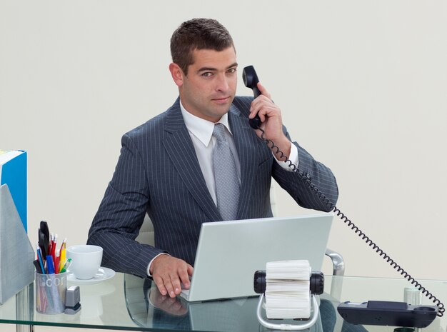 Serious businessman phone in his office