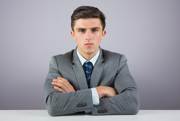 Serious businessman sitting at desk