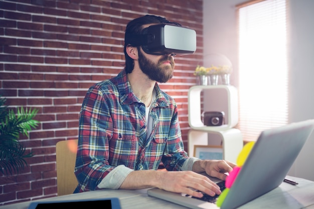 Serious businessman wearing 3D video glasses