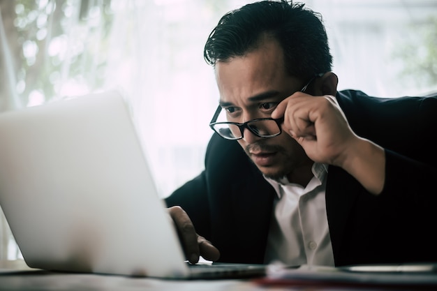 Photo serious businessman working on documents