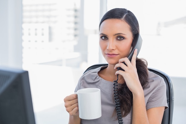 Serious businesswoman having a break