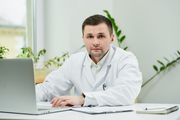 Serious caucasian doctor in white lab coat