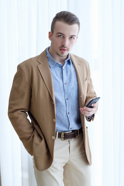 Serious confident purposeful ambitious young business man. casual stylish formal wear