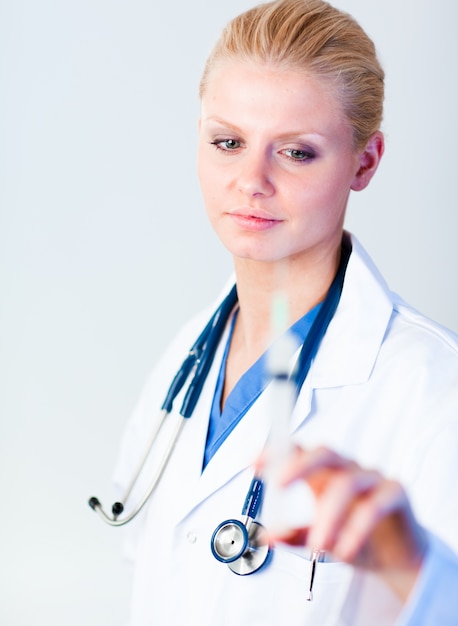 Serious Doctor holding a needle