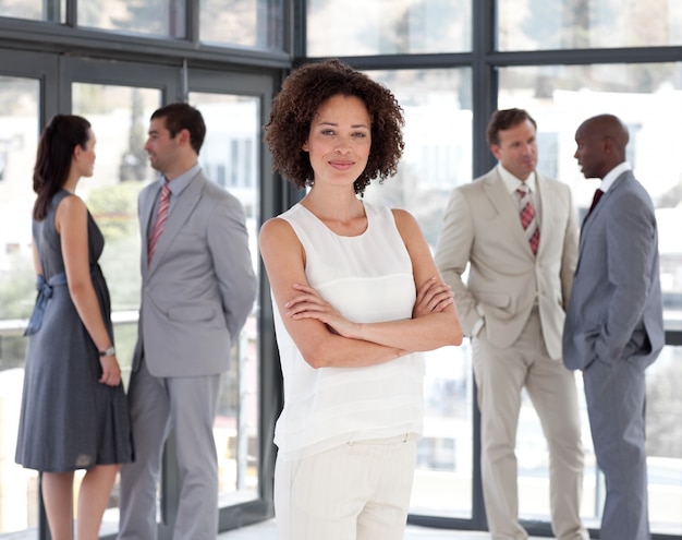 Serious female leader with her team