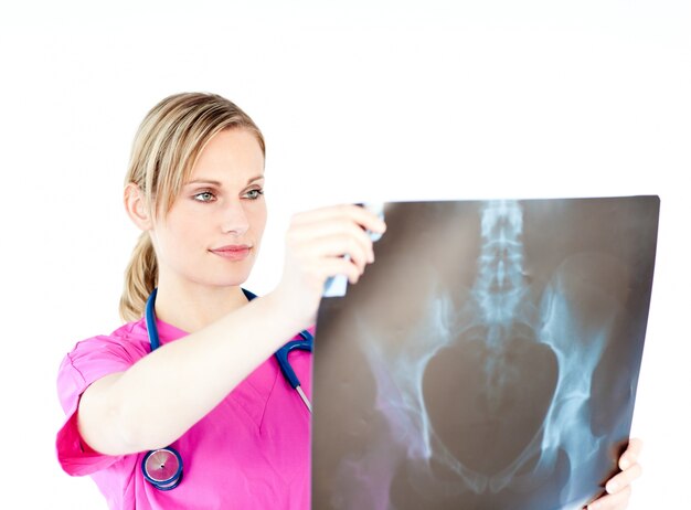 Photo serious female surgeon holding a x-ray