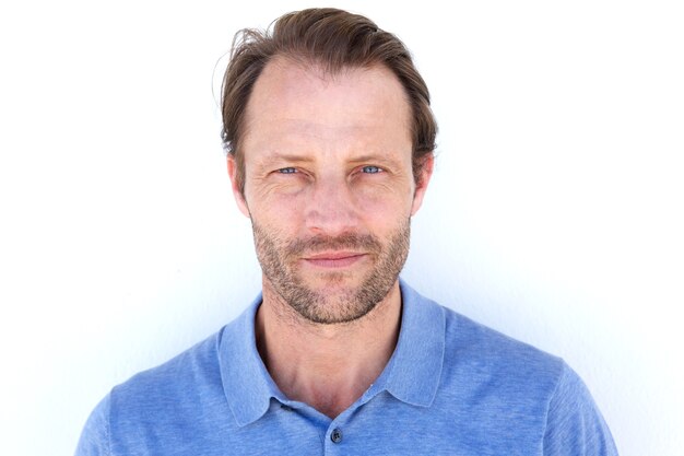 Serious handsome man against white background