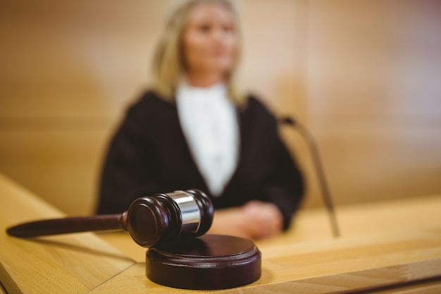 serious judge with a gavel wearing robes