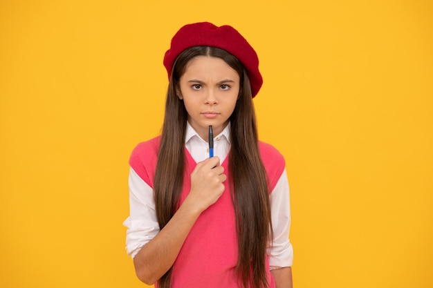 Serious kid in beret ready to study child making notes teenage student tween and youth