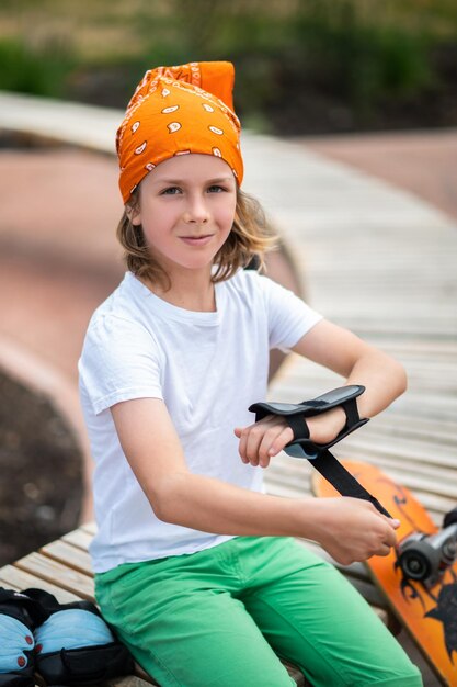 Serious kid preparing for the skateboarding workout