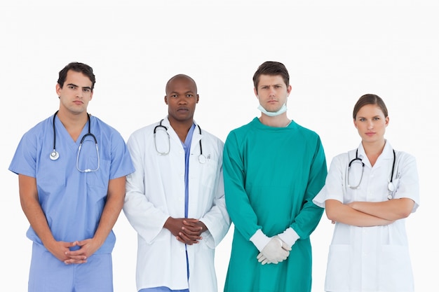 Serious looking medical team standing together