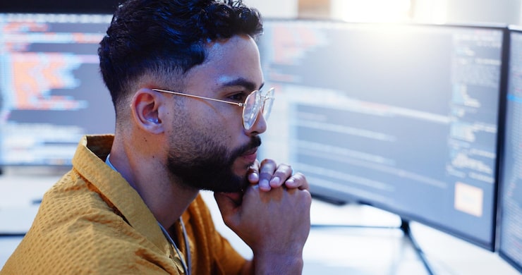 Photo serious man and coding with computer screen for cybersecurity developer update and app upgrade thinking working and coder tech with programmer search and software system planning in office