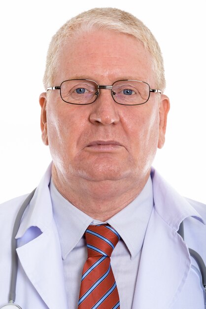 Serious mature man in doctor uniform