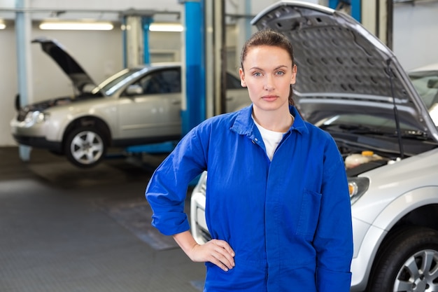 Serious mechanic looking at camera