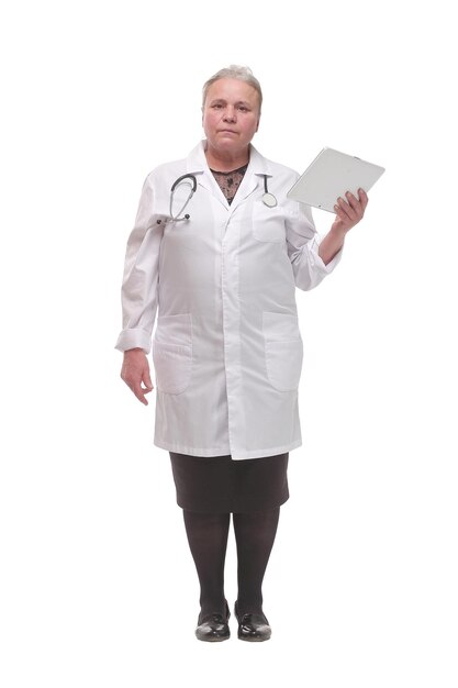 Serious medical doctor woman with tablet computer. Isolated on white background.