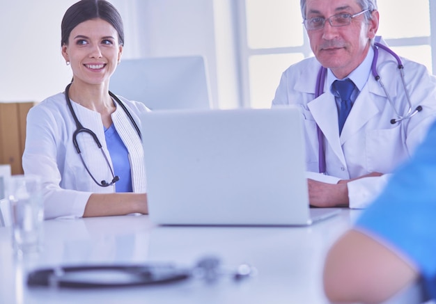 Serious medical team working in a bright office