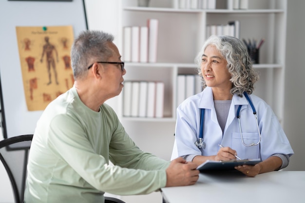 Serious middleaged female doctor pediatrician talk with male patient examine and discussing about the illness