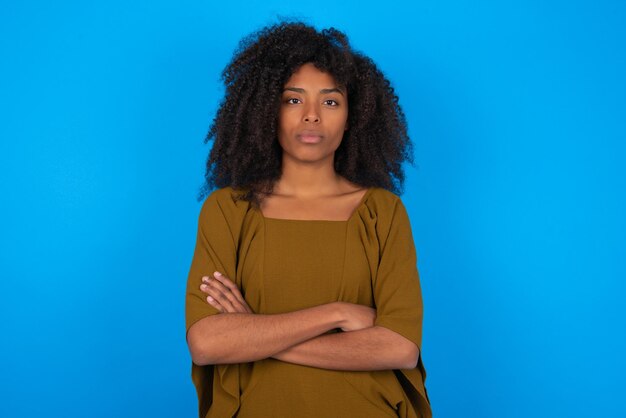 Serious pensive woman feel like cool confident entrepreneur cross hands