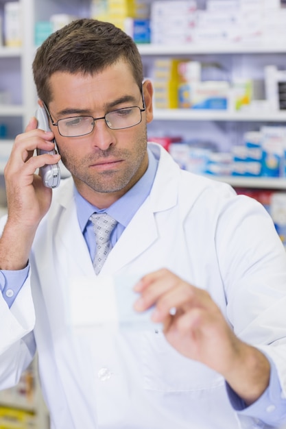 Serious pharmacist on the phone 