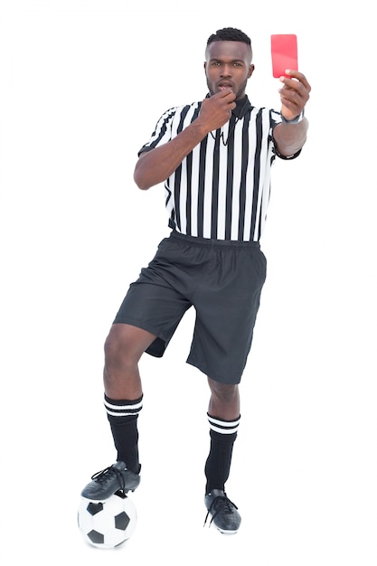 Photo serious referee showing red card