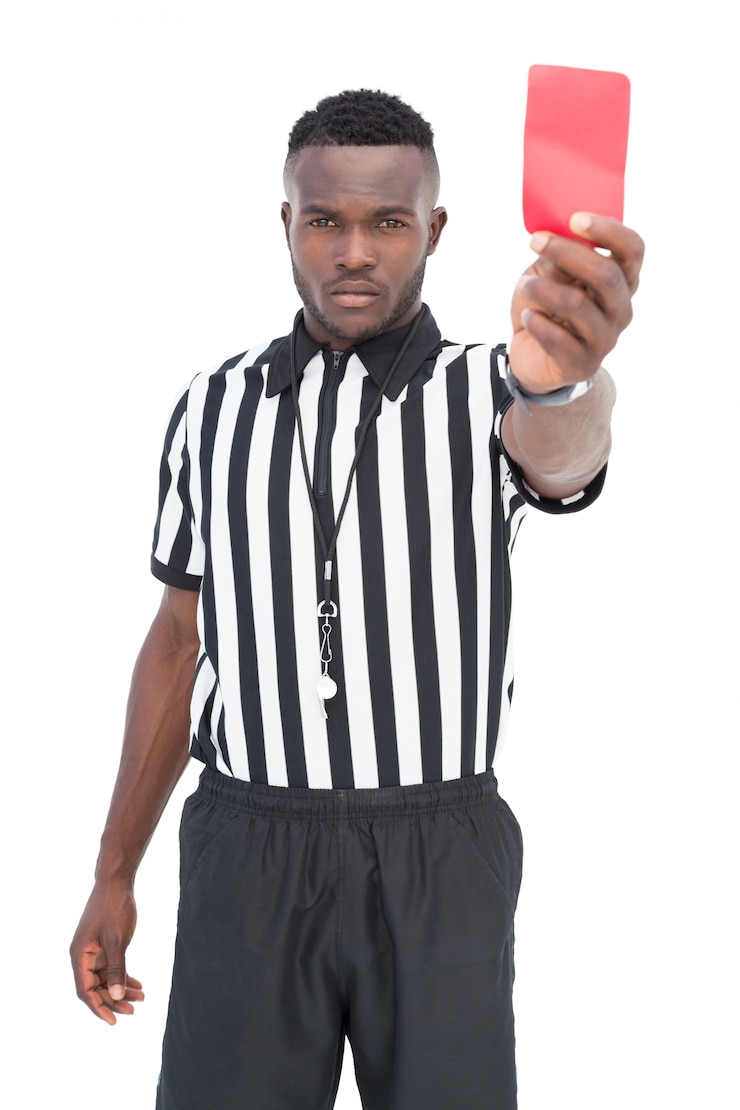 Photo serious referee showing red card