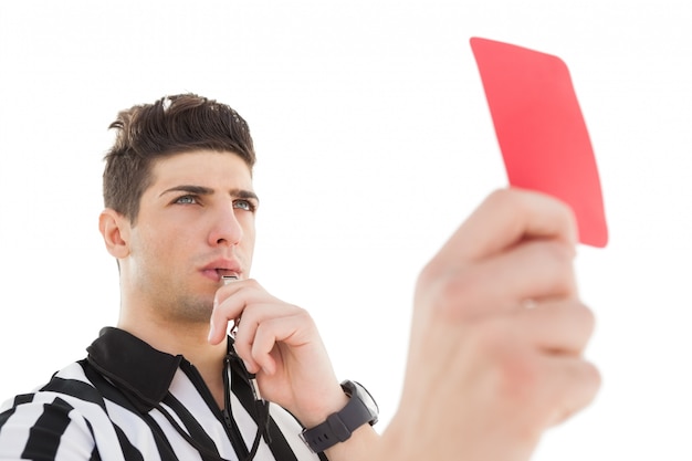 Photo serious referee showing red card