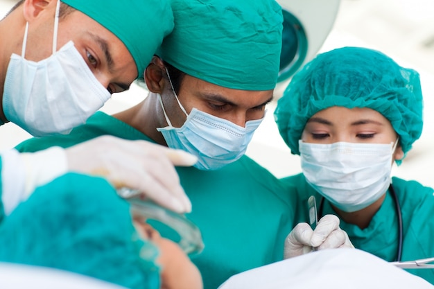 Serious surgeons during a surgery 