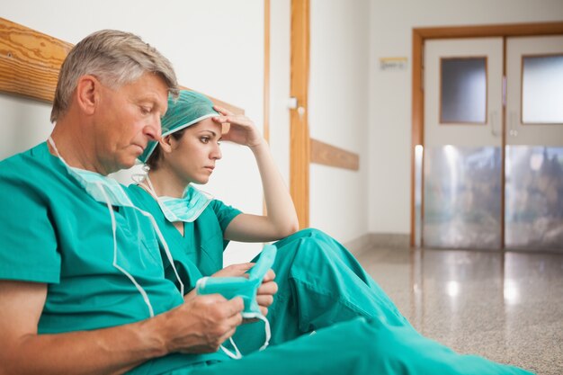 Serious surgeons waiting in the corridor