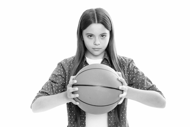 Serious teenager girl Teenage school child girl basketball player standing on white background Portrait of teen girl concentrated basketball player Sportive and active lifestyle Childhood team game