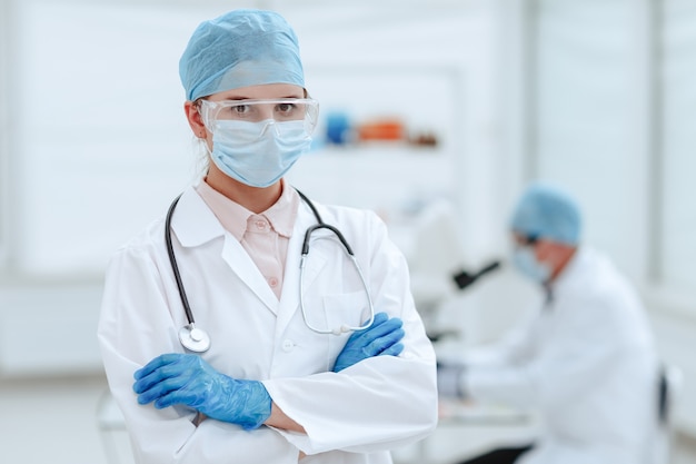 serious woman doctor standing in a medical laboratory