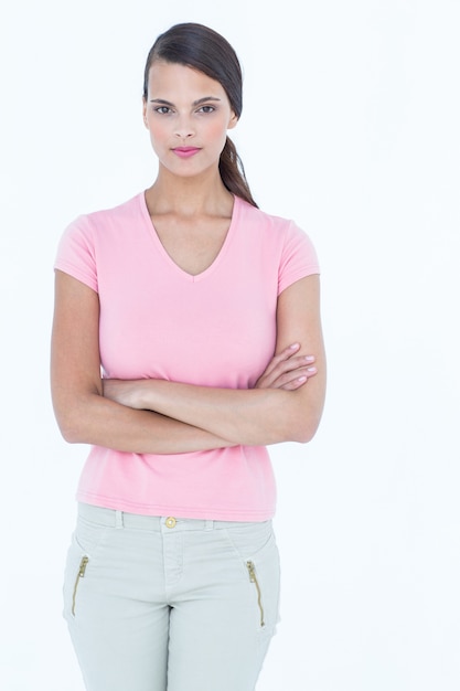 Serious woman looking at camera with arms crossed 