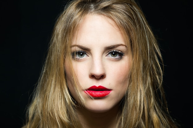 Serious woman with red lips