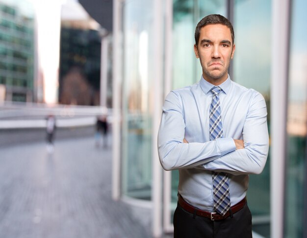 Serious young businessman posing