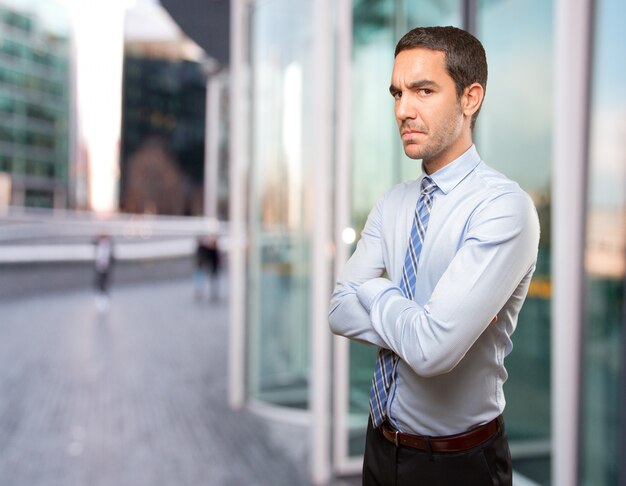 Serious young businessman posing