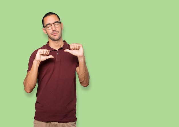 Serious young man doing a gesture of defeated