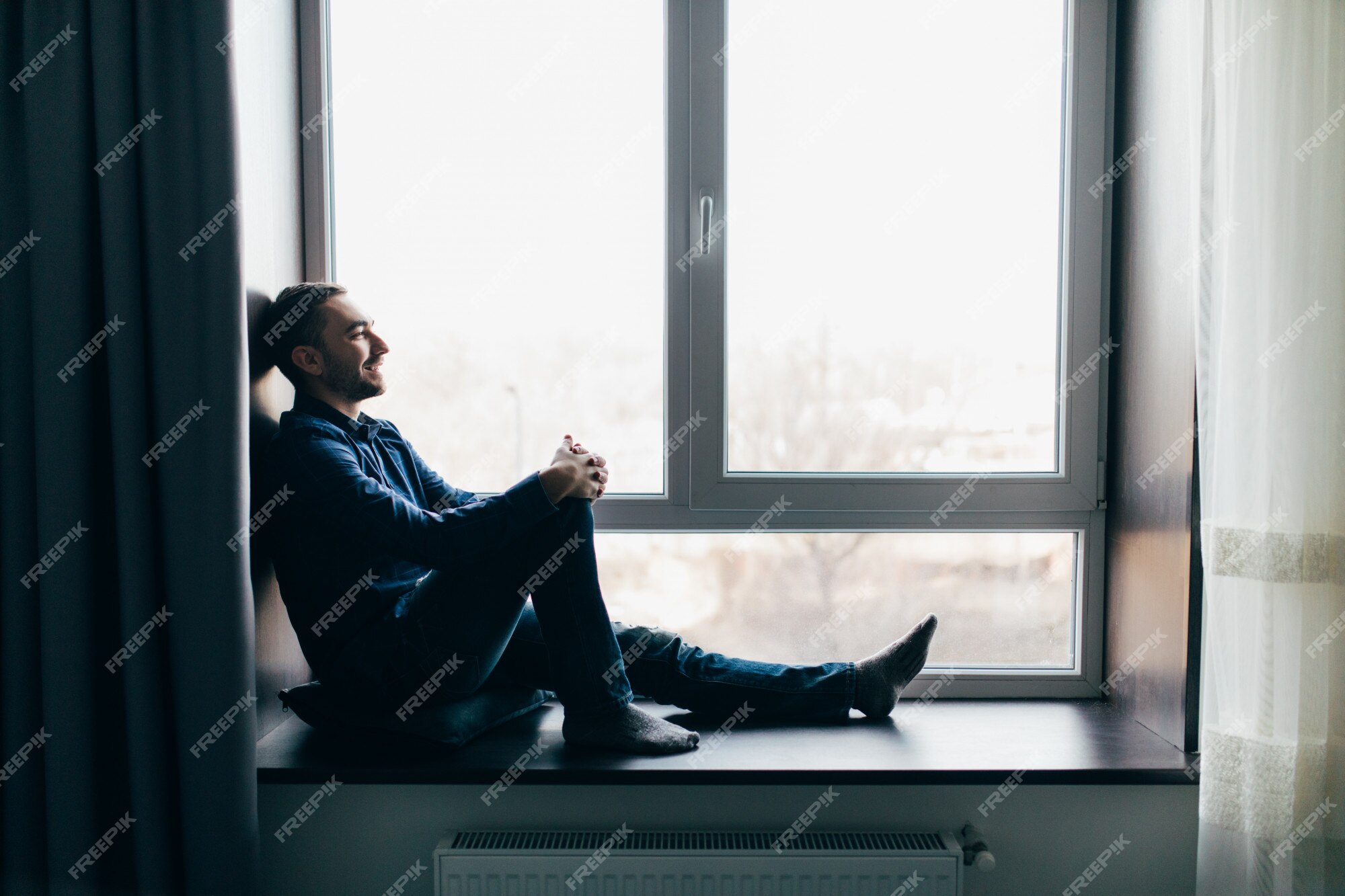 Young man at the window stock photo. Image of casual - 30207172